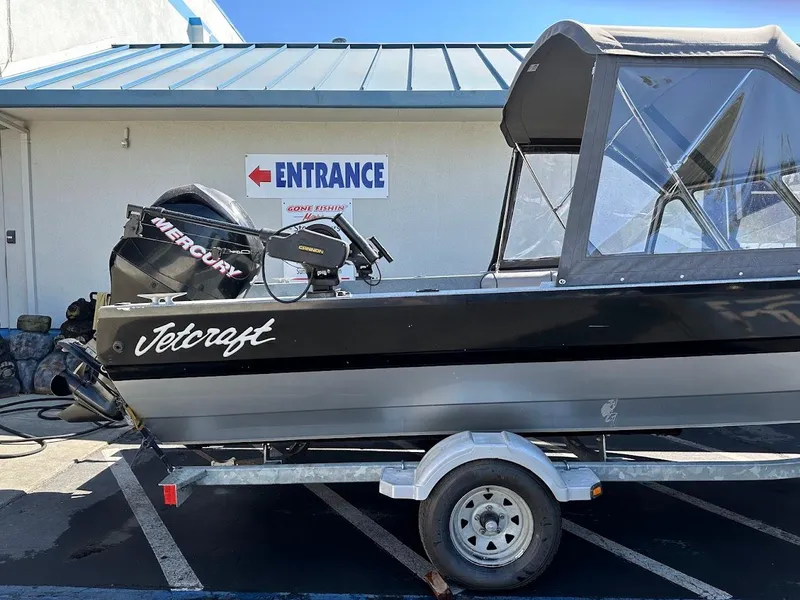 Slide: The Image of Jetcraft 1925 Adventurer boat, 2008 model, on trailer near entrance sign. - 7