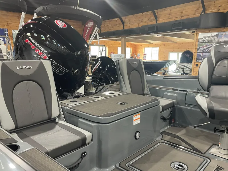 Slide: The Image of 2025 Lund 185 Impact GL boat interior with Mercury Pro XS engine, showroom display. - 9