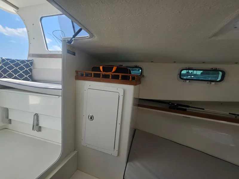 Slide: The Image of Interior of a 2019 Eastern 248 Explorer boat with seating and storage. - 10