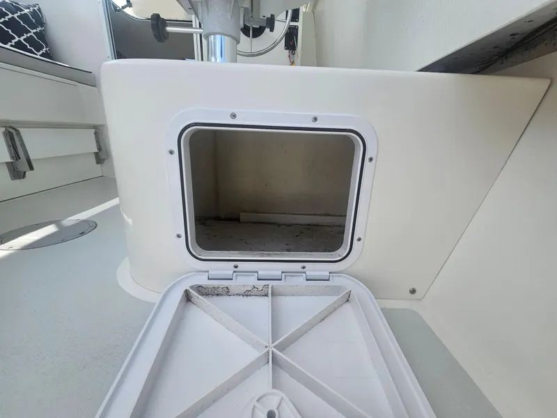 Slide: The Image of Open storage compartment on 2019 Eastern 248 Explorer boat interior. - 13