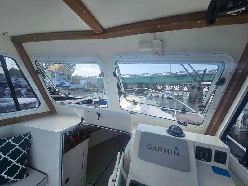Slide: The Image of Interior view of 2019 Eastern 248 Explorer boat with Garmin navigation system. - 24