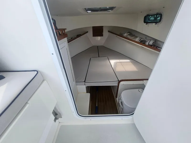 Slide: The Image of 2019 Eastern 248 Explorer cabin interior with seating and storage. - 26