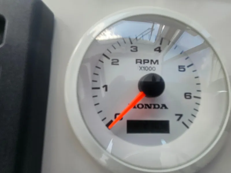 Slide: The Image of Close-up of a Honda RPM gauge on a 2019 Eastern 248 Explorer boat. - 29