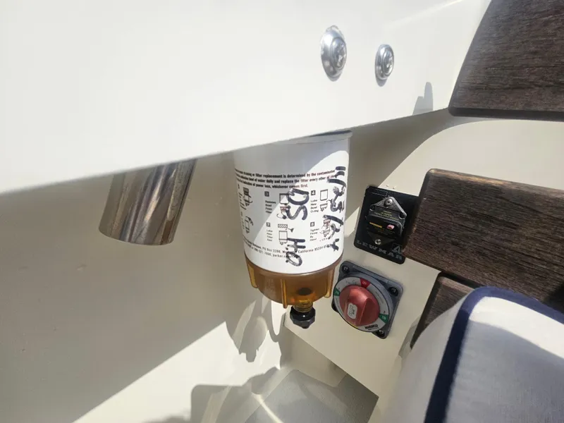 Slide: The Image of Fuel filter and switch panel on 2019 Eastern 248 Explorer boat. - 31