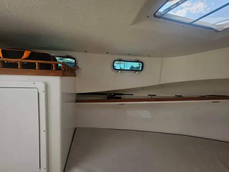 Slide: The Image of Interior cabin of 2019 Eastern 248 Explorer boat with skylight and storage. - 9