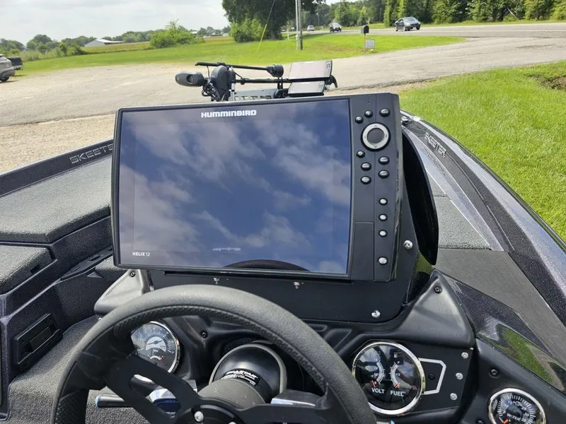 Slide: The Image of 2023 Skeeter ZXR 20 boat dashboard with Humminbird Helix 12 fishfinder and gauges. - 10