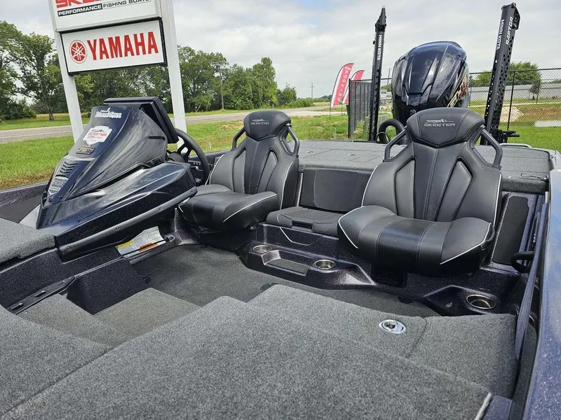 Slide: The Image of 2023 Skeeter ZXR 20 boat interior with Yamaha signage, featuring sleek black seats and modern design. - 11