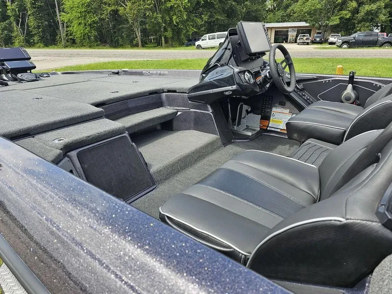 Slide: The Image of 2023 Skeeter ZXR 20 boat interior with sleek seating and advanced dashboard controls. - 14