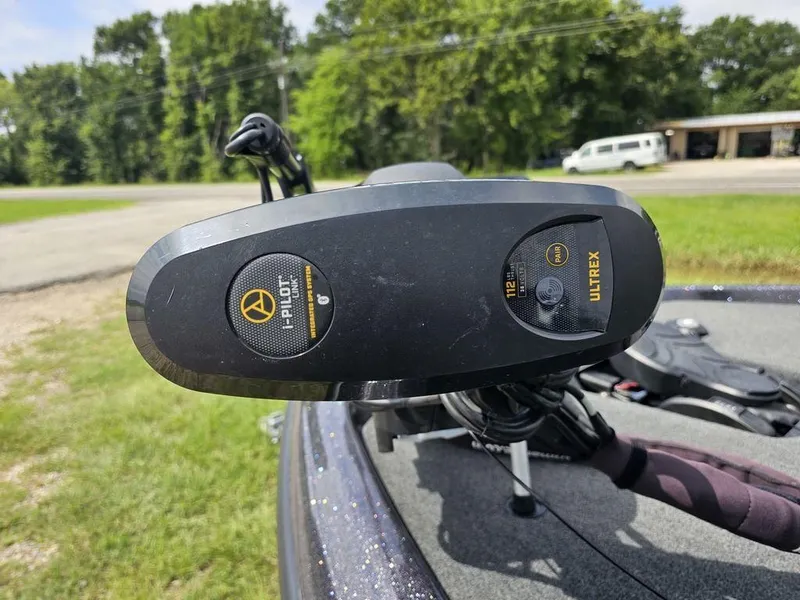 Slide: The Image of 2023 Skeeter ZXR 20 boat with i-Pilot Ultrex trolling motor in a grassy area. - 5