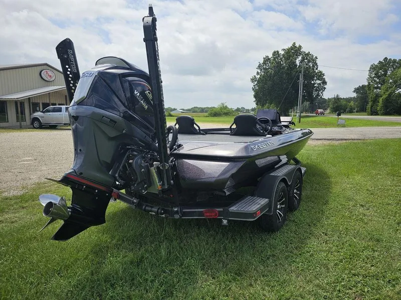 Slide: The Image of 2023 Skeeter ZXR 20 boat with Yamaha engine on grassy area near building. - 8