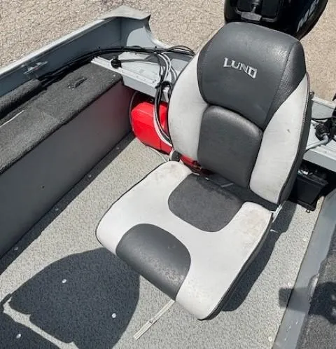 Slide: The Image of 2013 Lund 1400 Fury SS boat seat with gray and black upholstery. - 16