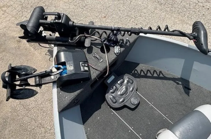 Slide: The Image of 2013 Lund 1400 Fury SS boat with trolling motor and control panel on deck. - 7