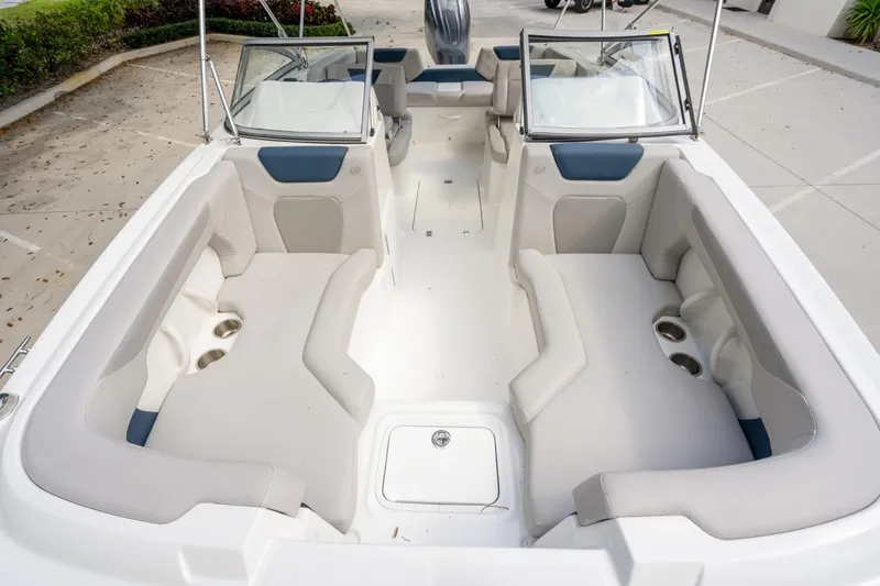 Slide: The Image of 2025 Hurricane SunDeck 2050 OB boat interior with spacious seating and cup holders. - 13