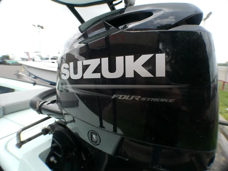 Slide: The Image of Suzuki four-stroke engine on 2016 Ankona Copperhead boat, close-up view. - 16