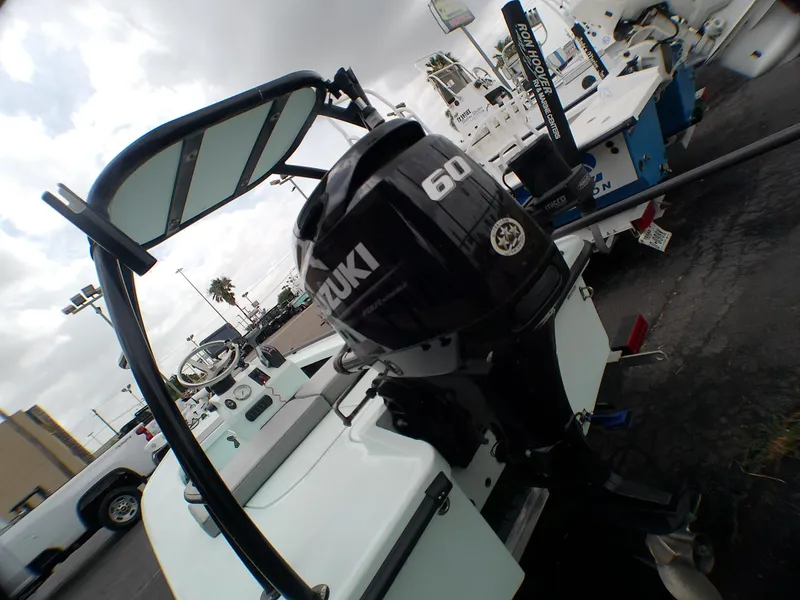 Slide: The Image of 2016 Ankona Copperhead boat with Suzuki 60 outboard motor, parked outdoors. - 17