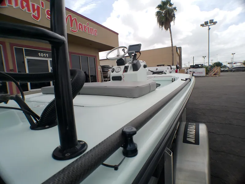 Slide: The Image of 2016 Ankona Copperhead boat at a marine dealership, showcasing sleek design and modern features. - 21