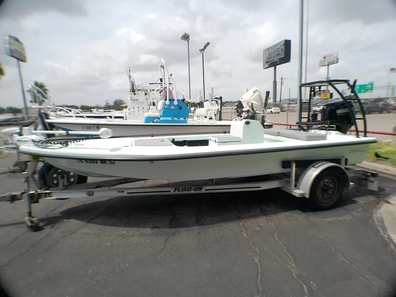 Slide: The Image of 2016 Ankona Copperhead boat on trailer in parking lot, overcast sky. - 6