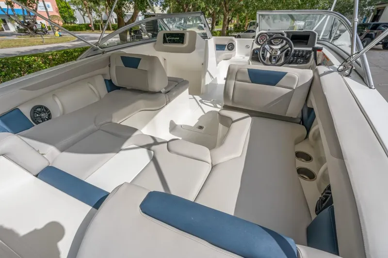 Slide: The Image of 2025 Hurricane SunDeck 2050 OB boat interior with spacious seating and modern dashboard. - 8