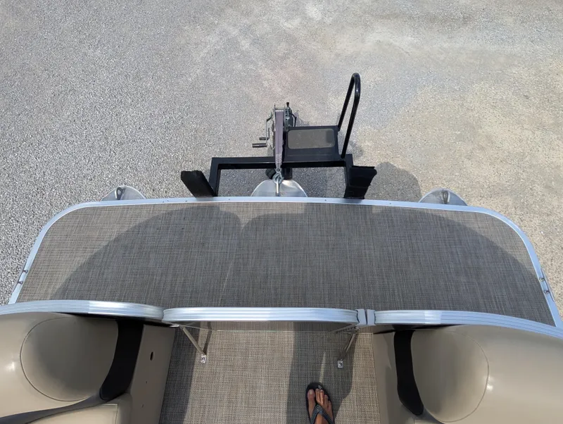 Slide: The Image of 2016 Manitou 23 Aurora pontoon boat deck with trailer hitch, viewed from above. - 22