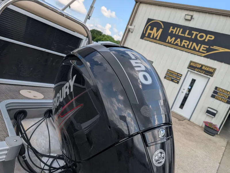 Slide: The Image of 2016 Manitou 23 Aurora with Mercury 150 engine at Hilltop Marine dealership. - 9