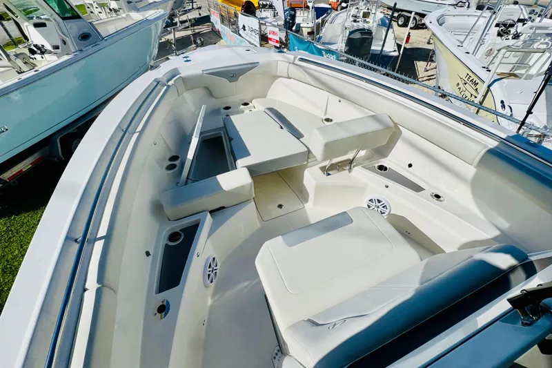 Slide: The Image of 2026 Sailfish 312 CC boat interior with seating and storage compartments. - 7
