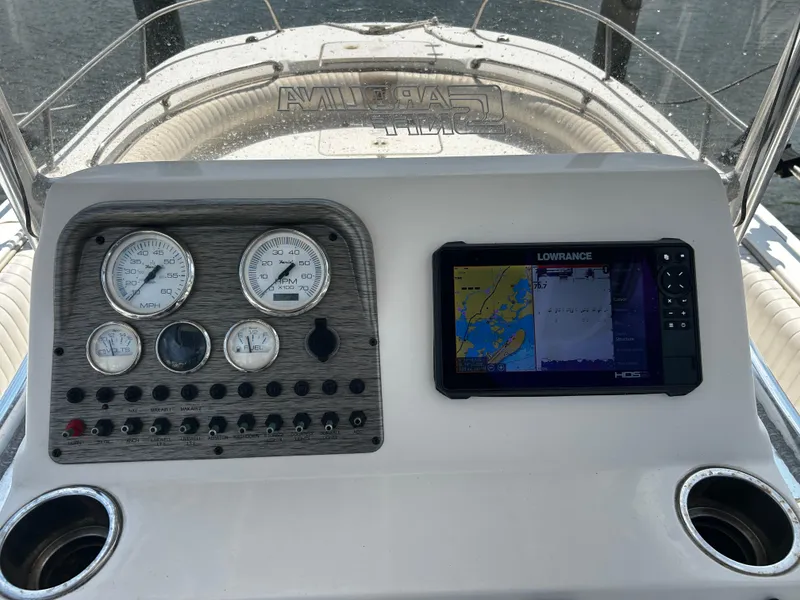 Slide: The Image of Dashboard of a 2015 Carolina Skiff 21 Ultra Elite with gauges and Lowrance GPS. - 12