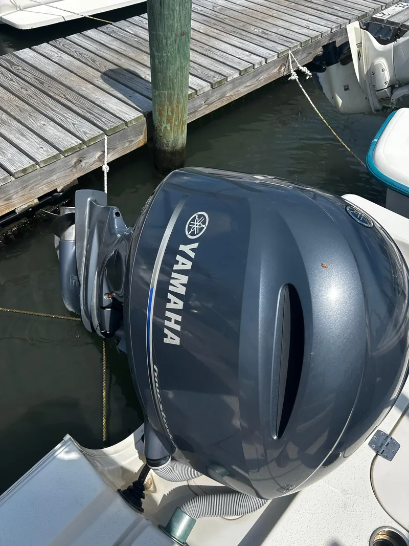 Slide: The Image of Yamaha outboard motor on 2015 Carolina Skiff 21 Ultra Elite at dock. - 20