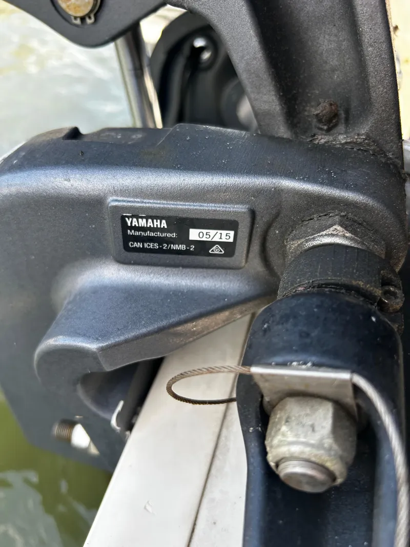 Slide: The Image of Close-up of a Yamaha motor part on a 2015 Carolina Skiff 21 Ultra Elite boat. - 32