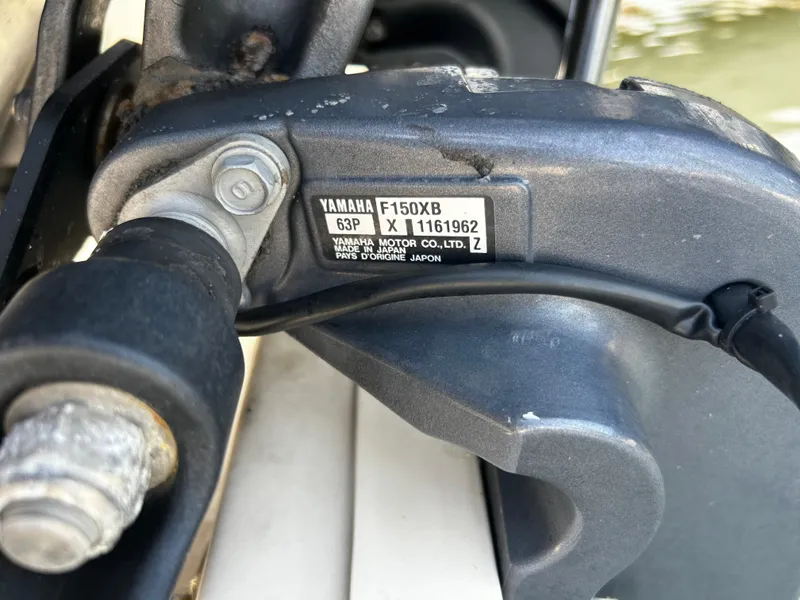 Slide: The Image of Close-up of Yamaha F150XB engine part on 2015 Carolina Skiff 21 Ultra Elite boat. - 33