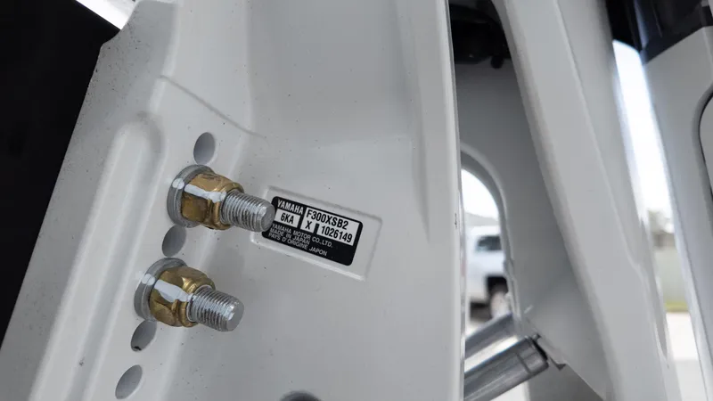 Slide: The Image of Close-up of Yamaha engine bolts on 2026 Tidewater 2700 Carolina Bay boat. - 14