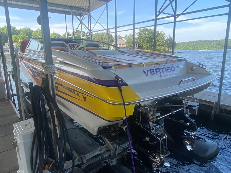Slide: The Image of 2006 Formula 353 FASTech boat docked, featuring vibrant yellow and purple design. - 11