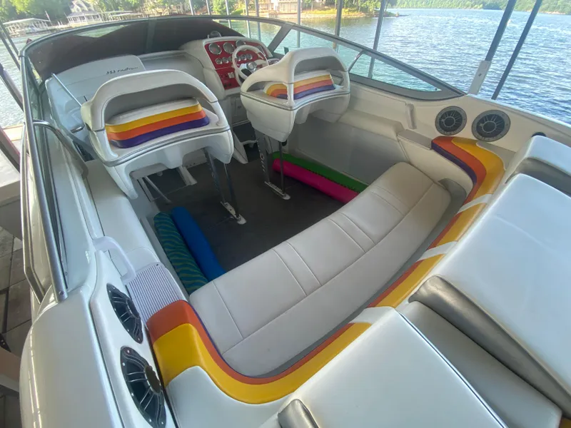 Slide: The Image of 2006 Formula 353 FASTech boat interior with colorful seating and lake view. - 16