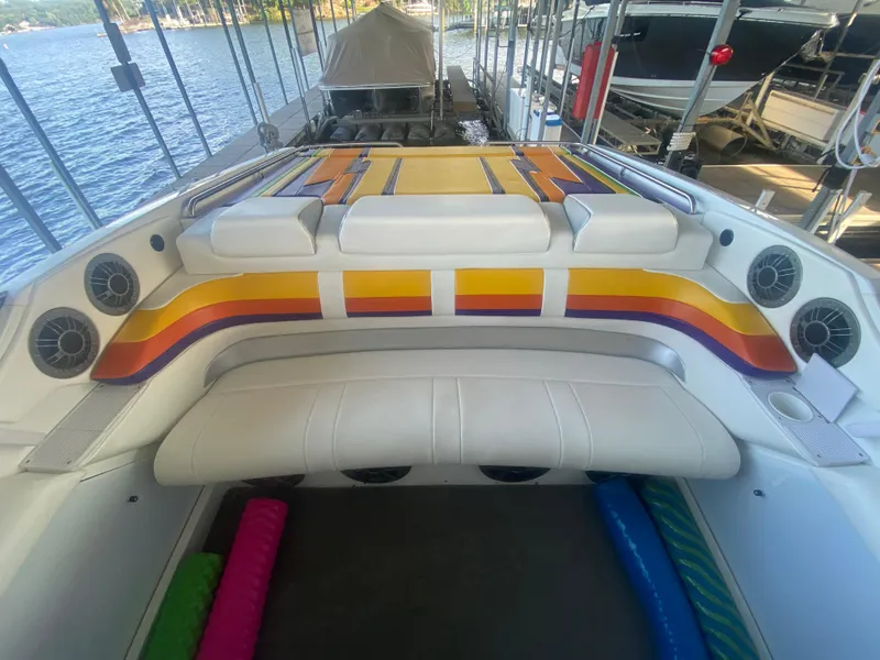 Slide: The Image of 2006 Formula 353 FASTech boat interior with colorful seating and lake view. - 17