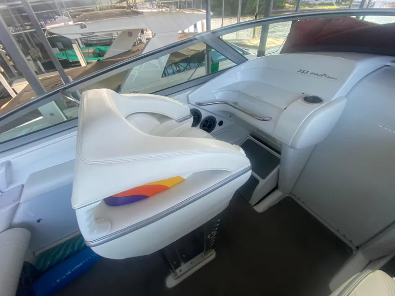 Slide: The Image of 2006 Formula 353 FASTech boat interior with white seating and dashboard. - 18