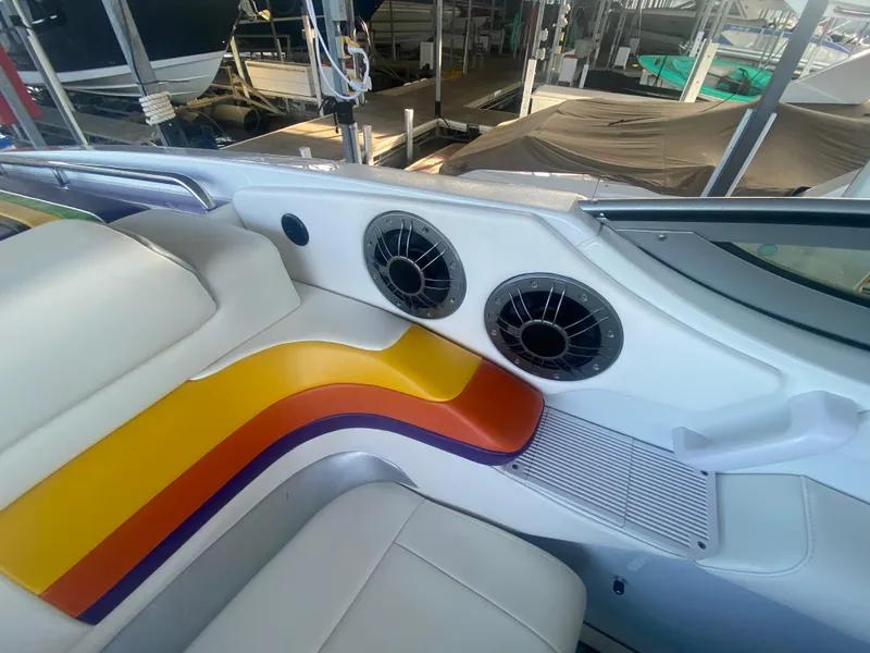Slide: The Image of 2006 Formula 353 FASTech boat interior with colorful seating and dual speakers. - 22