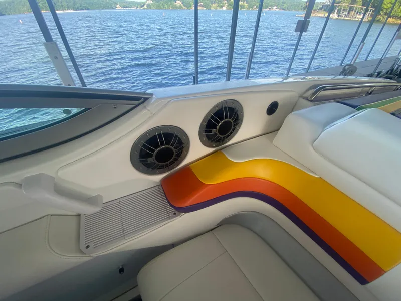 Slide: The Image of 2006 Formula 353 FASTech boat interior with colorful seating and lake view. - 23