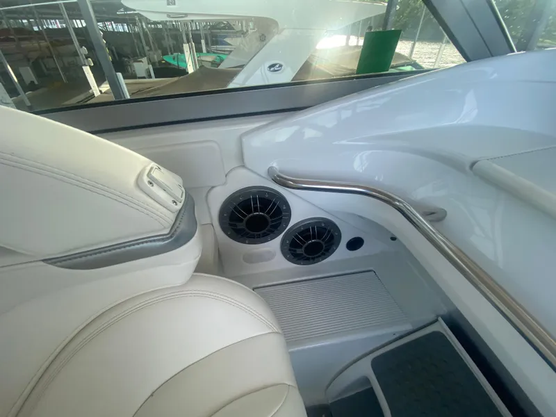 Slide: The Image of Interior of a 2006 Formula 353 FASTech boat, featuring white seating and air vents. - 24