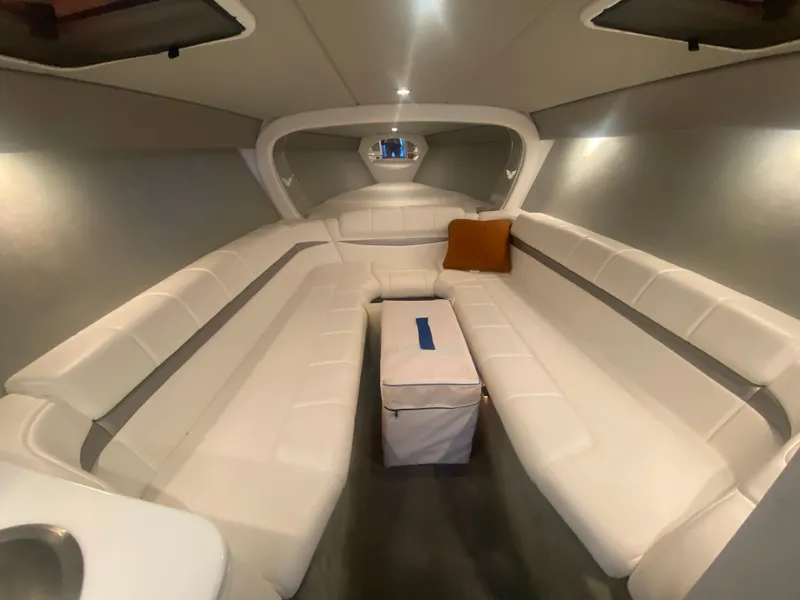 Slide: The Image of 2006 Formula 353 FASTech cabin interior with white seating and a central cushion. - 27