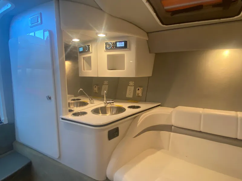 Slide: The Image of 2006 Formula 353 FASTech cabin interior with kitchenette and seating area. - 28