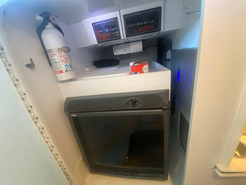 Slide: The Image of 2006 Formula 353 FASTech cabin interior with fire extinguisher and control panel. - 33