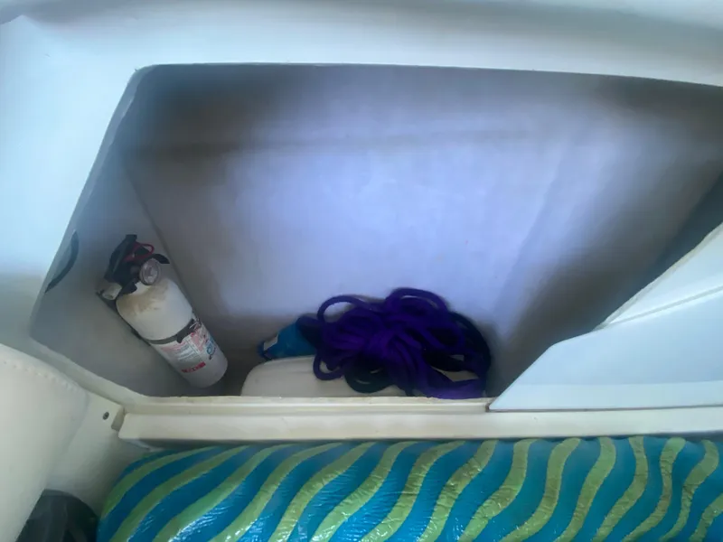 Slide: The Image of Storage compartment in 2006 Formula 353 FASTech with fire extinguisher and rope. - 37