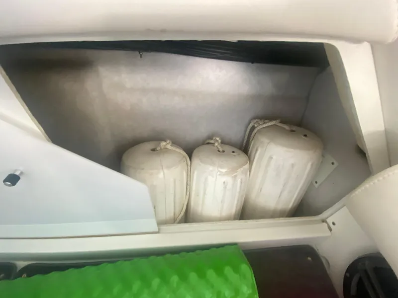 Slide: The Image of Storage compartment with boat fenders in a 2006 Formula 353 FASTech. - 38