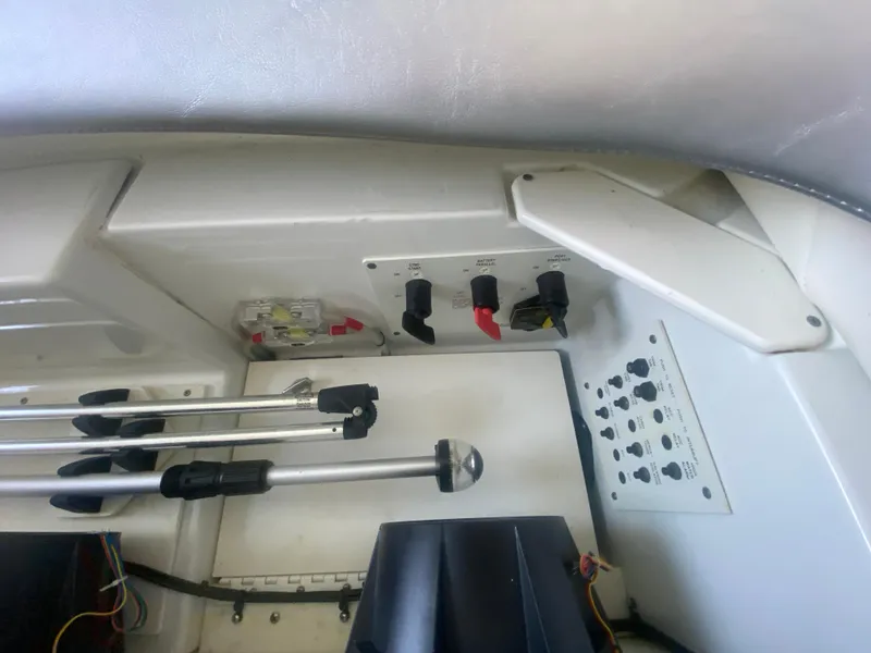 Slide: The Image of 2006 Formula 353 FASTech boat control panel with switches and levers. - 42