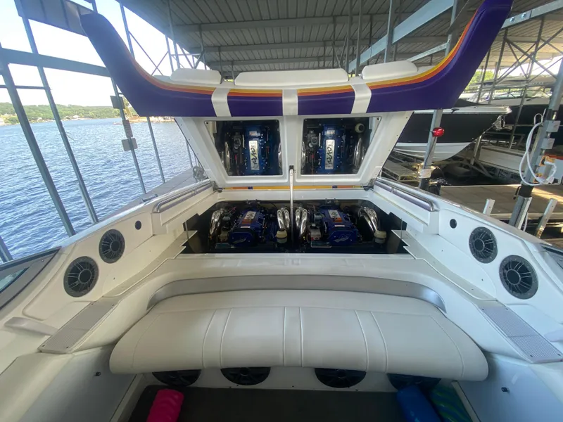 Slide: The Image of 2006 Formula 353 FASTech boat engine compartment with open hatch, docked by the water. - 43