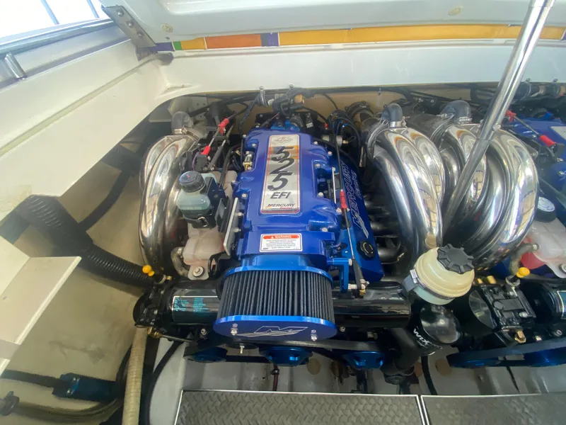 Slide: The Image of 2006 Formula 353 FASTech engine compartment with blue EFI engine and chrome components. - 44