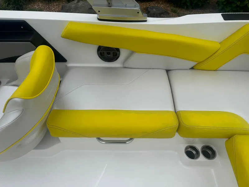 Slide: The Image of 2018 MasterCraft NXT22 boat interior with yellow and white seating. - 9