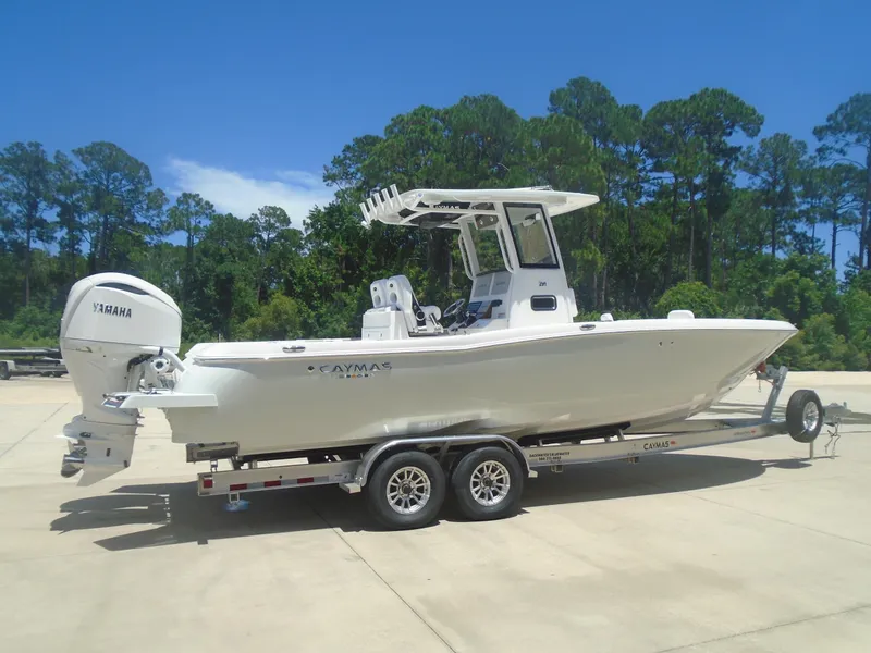 The Image of 2025 Caymas 291 boat on trailer, featuring Yamaha outboard, parked outdoors. - 1