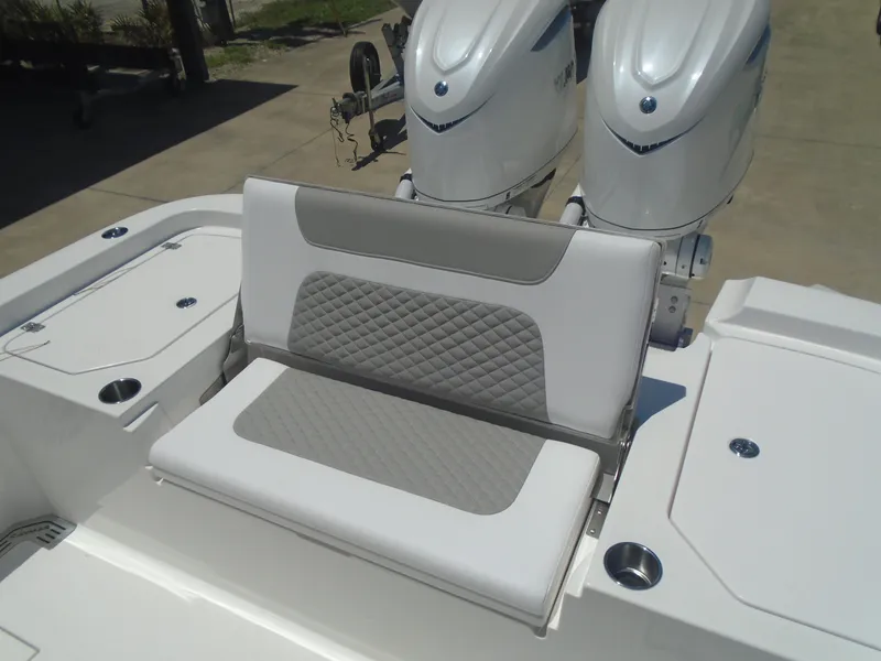 Slide: The Image of 2025 Caymas 291 boat with dual engines and cushioned seating. - 15