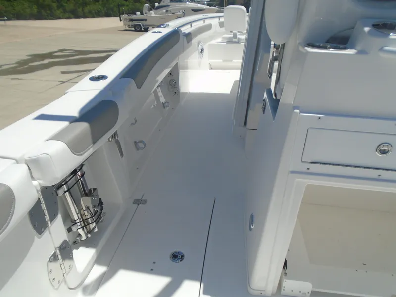 Slide: The Image of 2025 Caymas 291 boat interior with sleek white design and modern features. - 19