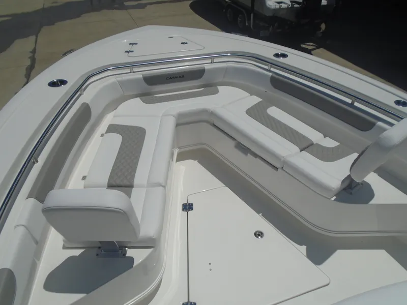 Slide: The Image of 2025 Caymas 291 boat interior with cushioned seating and sleek design. - 23